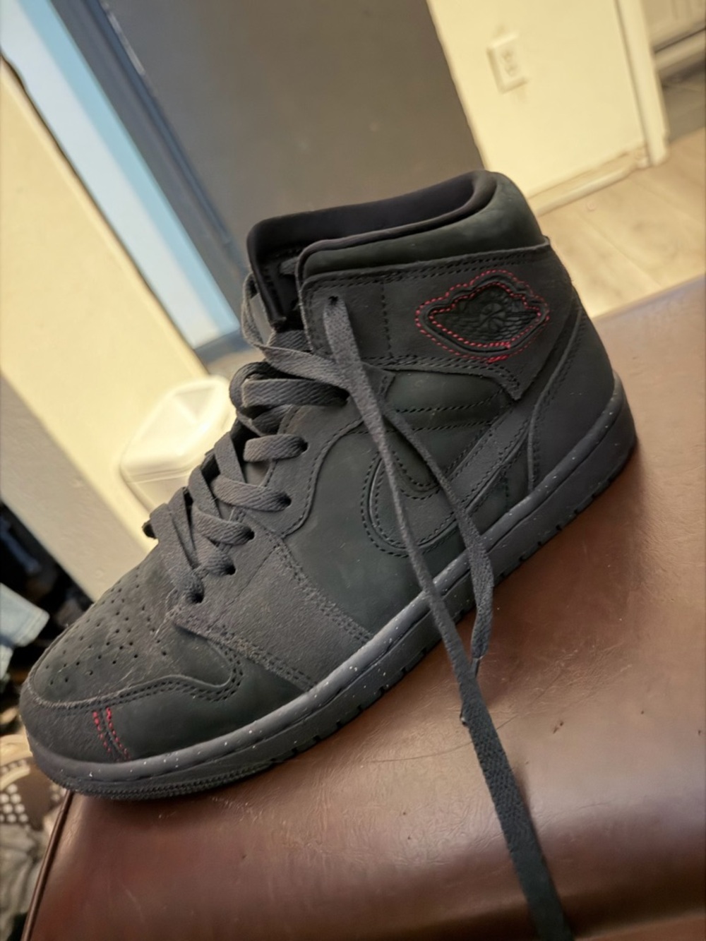 Jordan Black High-Top Sneaker with Red Insole Detail